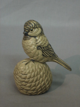 A Poole Pottery figure of a seated bird on a pine cone 5"