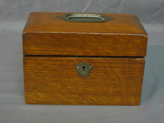 A 20th Century oak twin compartment tea caddy with hinged lid 8"
