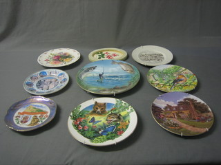A collection of decorative plates etc