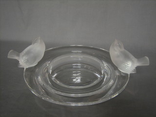 A 1960's circular Lalique glass bowl decorated figures of 2 birds, the base marked Lalique France 11"