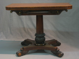 A William IV mahogany D shaped card table raised on a turned column with triform base and scrolled feet 36"