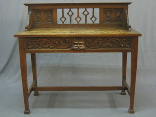 A Victorian carved oak hall table with carved 3/4 gallery, the base fitted 1 long drawer raised on square carved supports united by an H framed stretcher 41"
