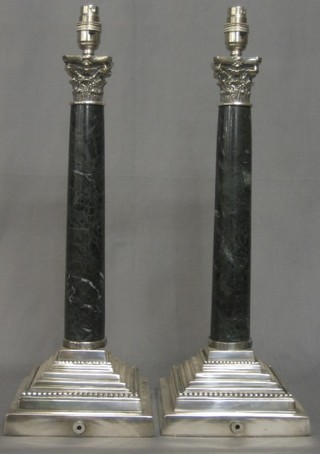 A pair of green marble and silver plated electric table lamps with stepped bases and Corinthian capitals