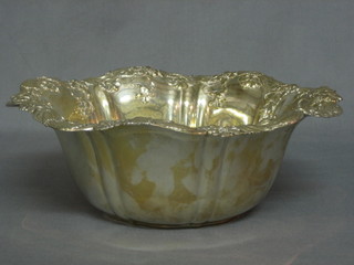 An American sterling silver bowl with cast rim, the base marked Sterling 20ozs
