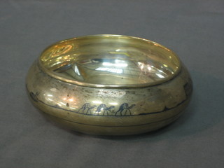A circular Eastern silver bowl with yellow decoration 3ozs