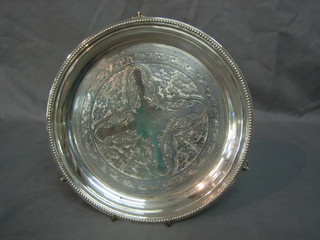 A circular silver plated salver with engraved decoration, bead work border 8"