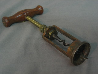 A 19th Century steel and mahogany corkscrew marked The Kings Patent 6064