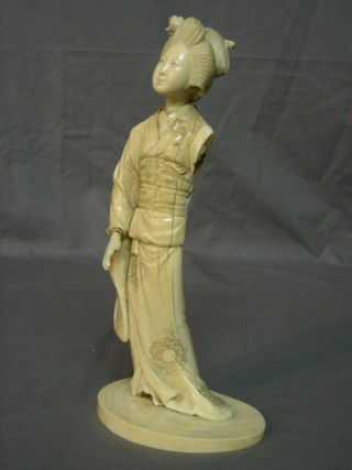 A 19th Century Japanese carved ivory figure of a standing lady (f - arm  missing) 11"