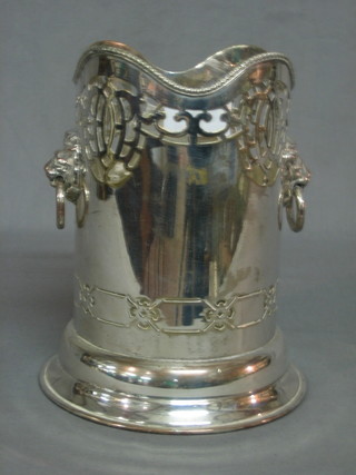A circular pierced silver plated twin handled soda siphon holder 7"