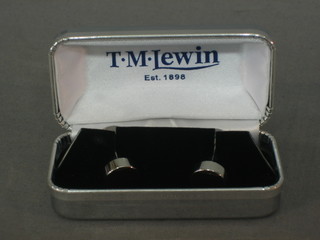 A pair of white metal cufflinks set amethyst type stones
