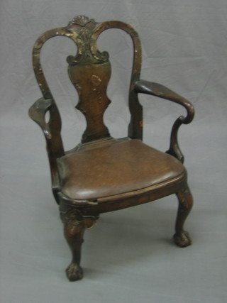 A Georgian walnut childs open arm carver chair with vase shaped slat back and upholstered seat raised on carved cabriole ball and claw supports (old break to left arm)