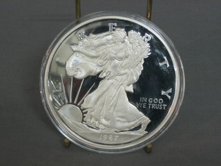 A 1987 American silver proof medallion, marked One Half Pound of Fine Silver 999, 8ozs