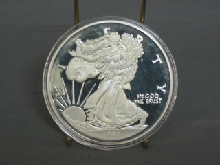 A 1991 American silver proof medallion, marked One Half Pound of Fine Silver 999, 8ozs