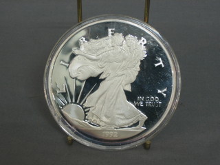 A 1992 American silver proof medallion, marked One Half Pound of Fine Silver 999, 8ozs