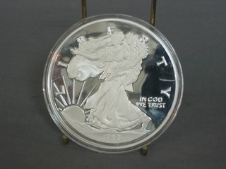 A 1993 American silver proof medallion, marked One Half Pound of Fine Silver 999, 8ozs