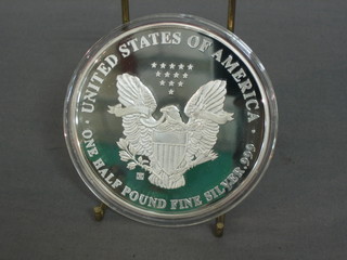A 1994 American silver proof medallion, marked One Half Pound of Fine Silver 999, 8ozs