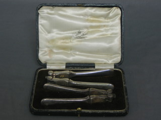 A pair of silver plated nut crackers by Mappin & Webb, cased