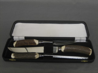 A 3 piece carving set with stag horn handle, cased
