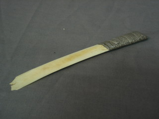 An Edwardian ivory paper knife with embossed silver handle, London 1903 (blade damaged)