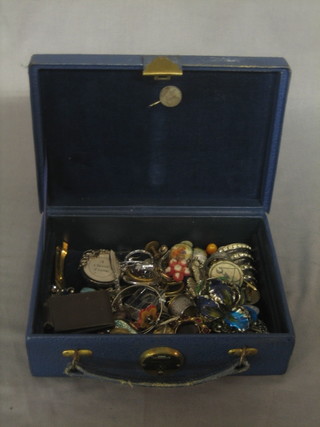 A blue jewellery box containing a quantity of costume jewellery