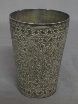 An Eastern engraved white metal beaker 5"