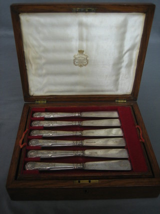 A set of 6 silver plated Kings pattern fish knives and forks contained in an oak box