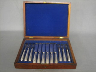 A set of 6 19th Century silver plated fruit knives and forks contained in a mahogany canteen box