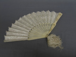 A 19th Century fan contained in a silk box