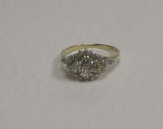 An 18ct gold cluster ring set diamonds
