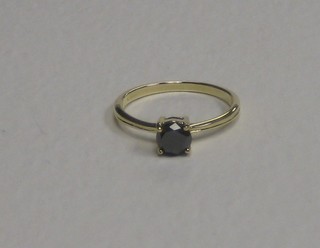 A 9ct gold solitaire dress ring set a black diamond