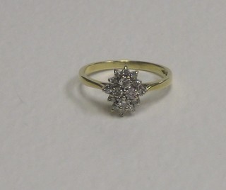 A lady's 9ct gold cluster ring set diamonds