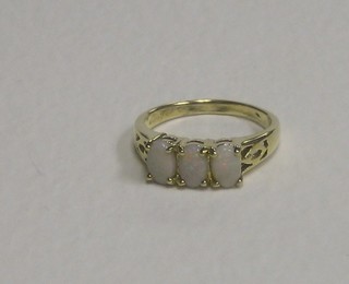 A 9ct gold dress ring set 3 oval cut opals