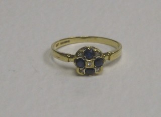 A 9ct gold cluster ring set 4 sapphires supported by diamonds