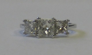 A lady's 18ct white gold dress/engagement ring set 3 square cut diamonds, approx 2.0ct (please note these diamonds have been treated to enhance their clarity)