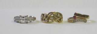 A gilt metal dress ring set white stones and 2 others