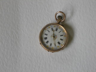 An engraved gilt metal fob watch with enamelled dial, Roman numerals