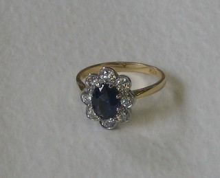 A lady's 18ct yellow gold dress ring set an oval cut sapphire surrounded by 8 diamonds approx (0.90 & 1.45cts)