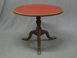 A circular Georgian mahogany tripod table, the top inset red writing surface raised on pillar and tripod supports 28"