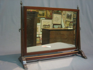 A 19th Century rectangular plate dressing table mirror contained in an inlaid mahogany frame 24"