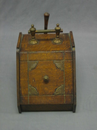 A Victorian oak coal box with hinged lid, complete with zinc liner 12"