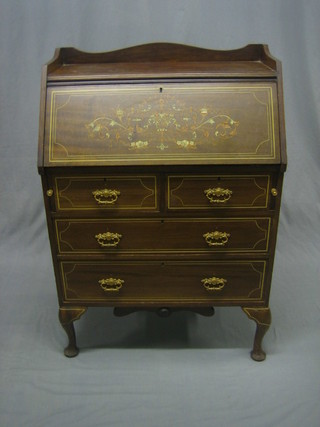 An Edwardian inlaid mahogany bureau with three-quarter gallery, the fall front revealing a well fitted interior above 2 short and 2 long graduated drawers raised on cabriole supports 28"