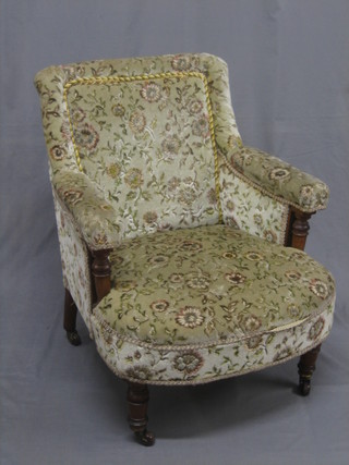 A Victorian honey oak tub back chair upholstered in green sculptured material, back leg signed and numbered Gillow & Co