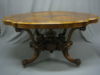 A handsome Victorian oval figured walnut centre table, raised on 4 scroll supports 60"