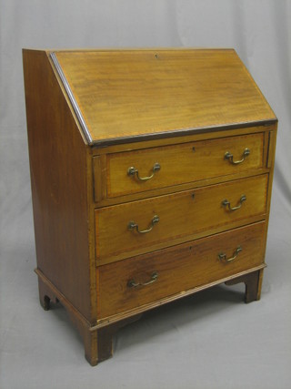 An Edwardian inlaid mahogany bureau, the fall front revealing a well fitted interior above 3 long drawers, raised on bracket feet 25"