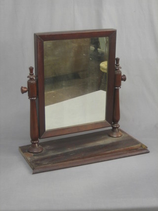 A Victorian rectangular plate dressing table mirror contained in a mahogany swing frame 22"