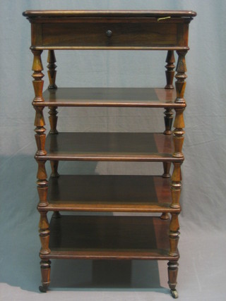 A Victorian rosewood 4 tier what-not, the hinged rising top fitted a drawer and raised on turned supports with brass caps and castors, drawer marked Lehr 21"