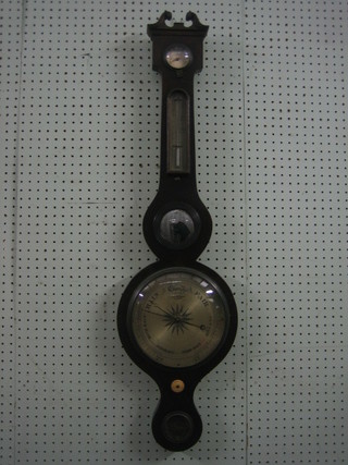 An 18th/19th Century mercury wheel barometer and thermometer with silvered dial having a damp/dry indicator, barometer, mirror and spirit level by G Kalabergo