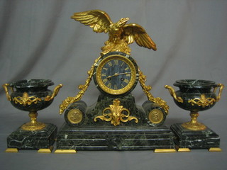 A handsome French malachite coloured marble and gilt ormolu 3 piece clock garniture comprising striking mantel clock contained in a drum shaped case surmounted by a gilt figure of an eagle with wings outstretched, together with 2 twin handled side urns