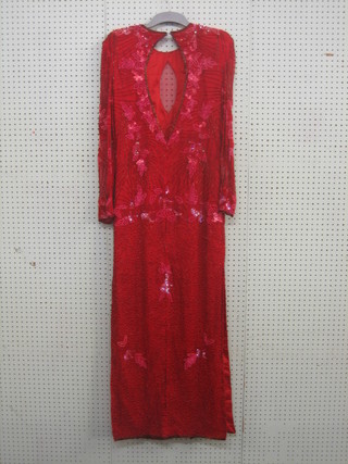 A lady's bead work full length evening dress by Pinky Creations size 10, together with a Judith Anne evening dress