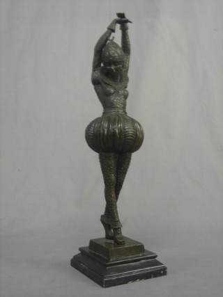 A reproduction Art Deco style bronze figure of a standing dancer, raised on a square marble base 20"